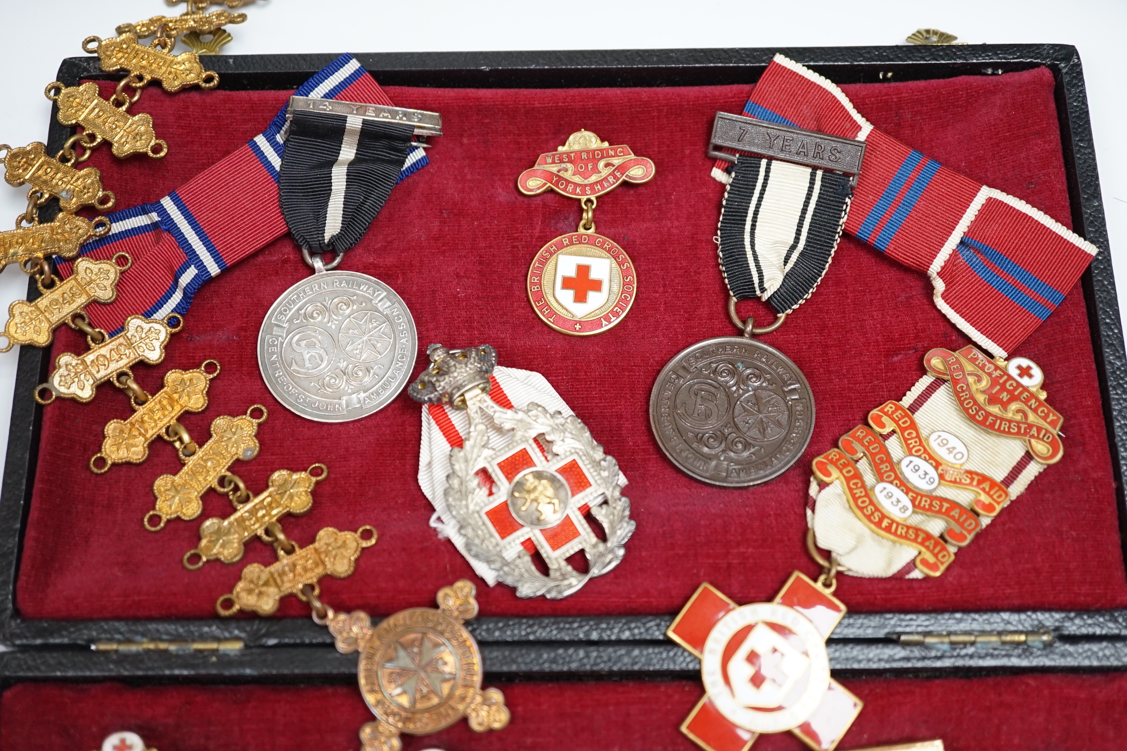 A collection of British Red Cross, etc. medals, awards and memorabilia including medals in original card boxes, a WWII medal group with miniatures including a Voluntary Medical Services Medal, proficiency in first aid me